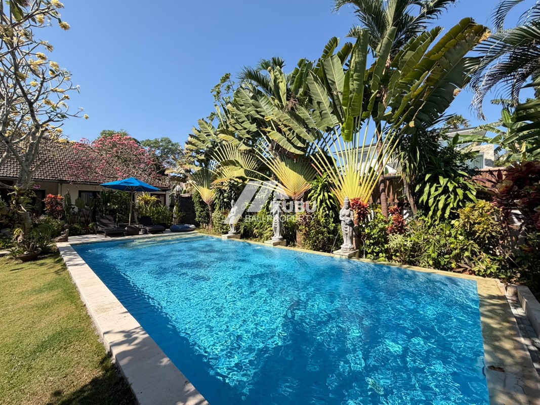 KBP1665 A stunning villa blending modern minimalist design with traditional Joglo elements, situated within a residential complex.